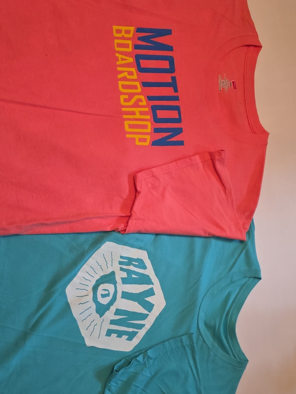 (2) Coral 'MOTION BOARD SHOP' & Aqua "RAYNE" Graphic Tee